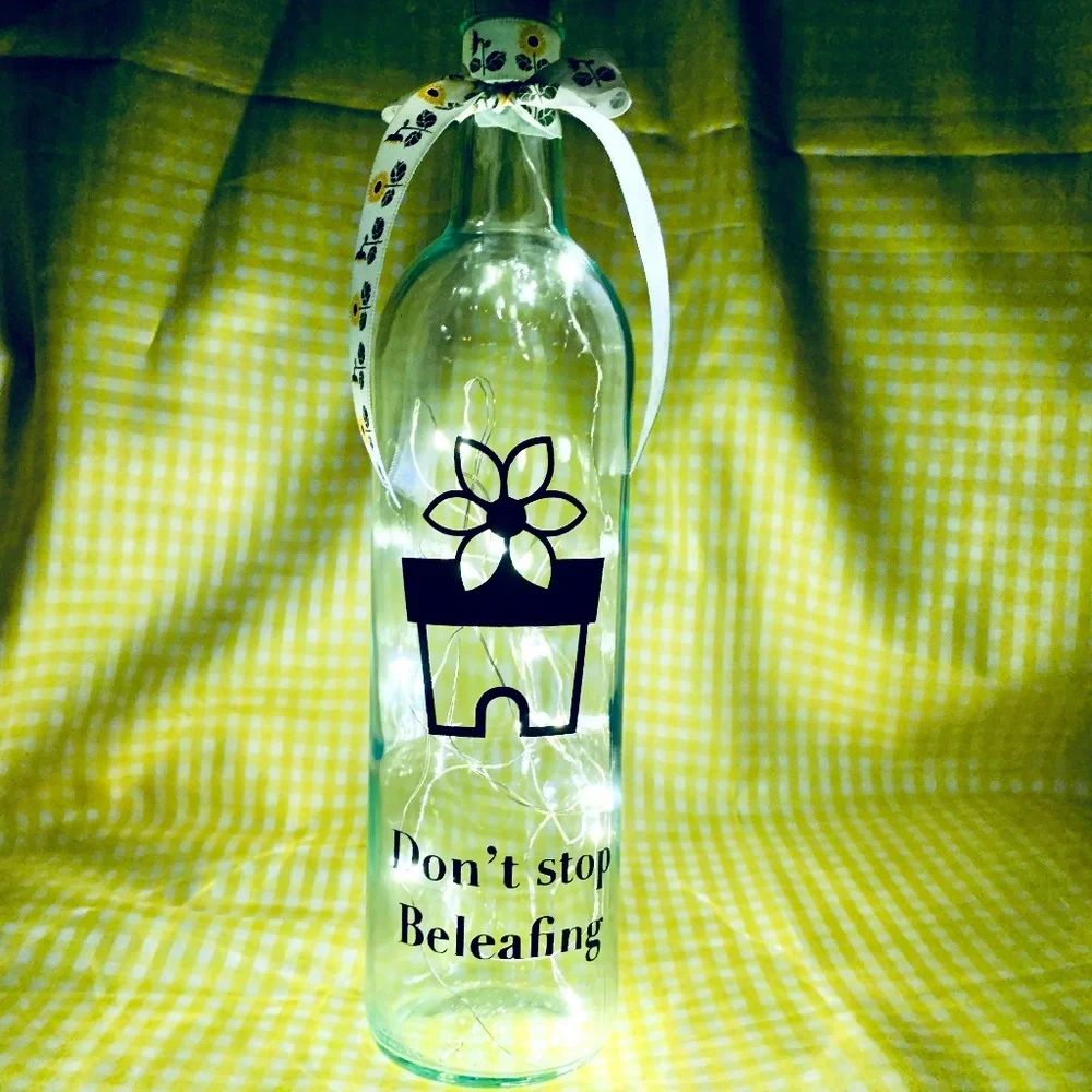 ‘Don’t Stop Beleafing’ logo wine bottle lantern